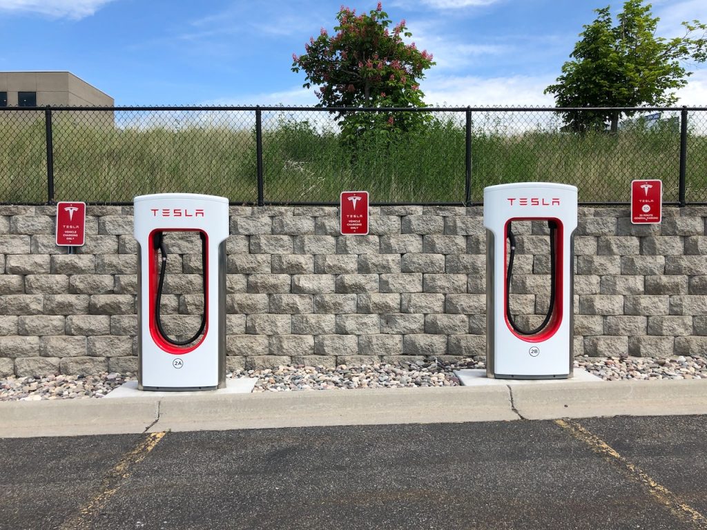 Photo by Chad Russell: https://www.pexels.com/photo/two-white-and-red-tesla-charging-station-2480315/