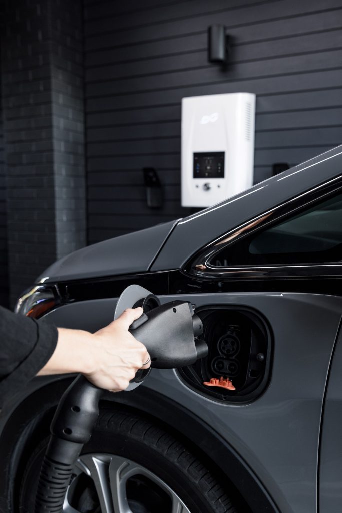 Photo by dcbel: https://www.pexels.com/photo/person-holding-car-electric-charger-11678699/ with ocpp